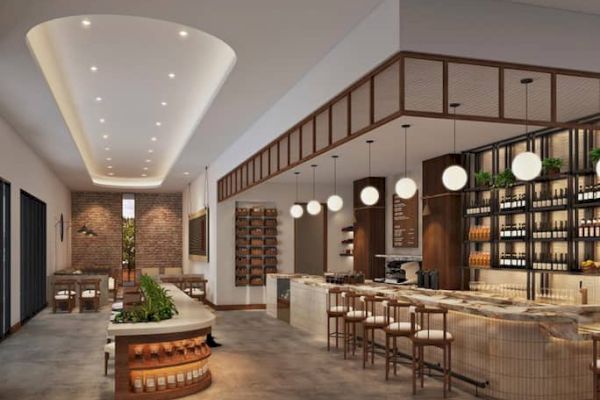 The image shows a modern restaurant interior with a bar, round lights, and seating areas, featuring a warm and inviting design.