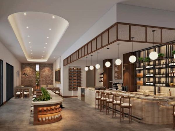 The image shows a modern restaurant interior with a bar, round lights, and seating areas, featuring a warm and inviting design.