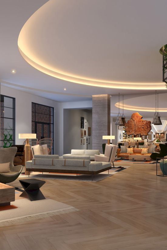 A spacious, modern living area with sleek furniture, large windows, wooden floors, and a central column with plants.