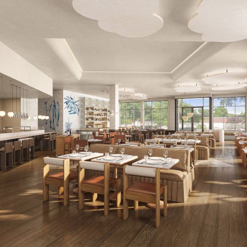 A modern restaurant interior with wooden tables and chairs, soft lighting, and large windows creating an inviting atmosphere.