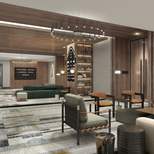 The image shows a modern, stylish lounge with seating, decorative lighting, and a contemporary design. It features wood accents and art pieces.