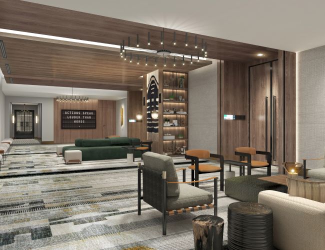 The image shows a modern, stylish lounge with seating, decorative lighting, and a contemporary design. It features wood accents and art pieces.